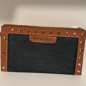 Michael Kors denim and leather clutch.